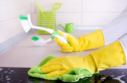 Local cleaner treating stains on a living room sofa