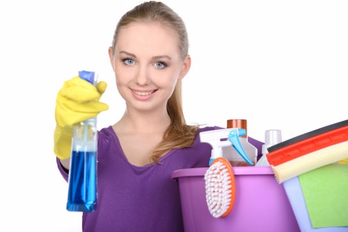 Vacuuming and dusting an empty property during move-in cleaning
